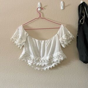 Cropped off-shoulder boho beach top with crochet lace hem in white